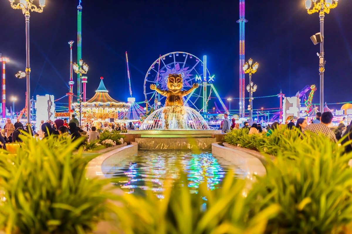 Global Village carnival lights beside the water